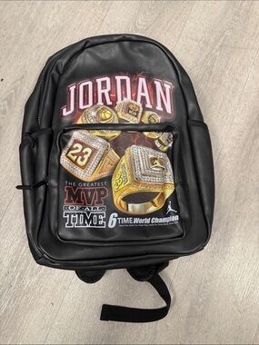 Jordan Black Backpack with Gold Ring Graphic
